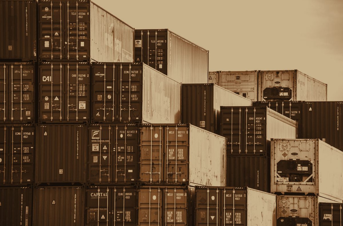 Shipping containers stacked at port, representing Merova Tradex's sourcing and freight network